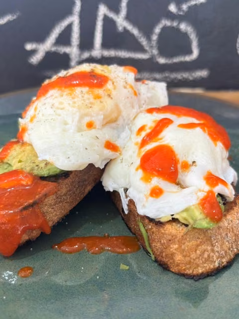 Smashed avocado toast with poached eggs in Hout Bay.
