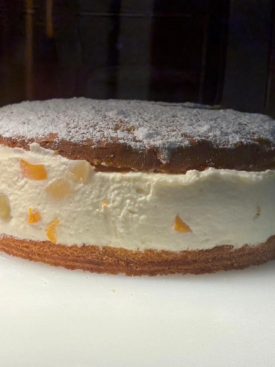 Whole cream cake of the day dusted with icing sugar.