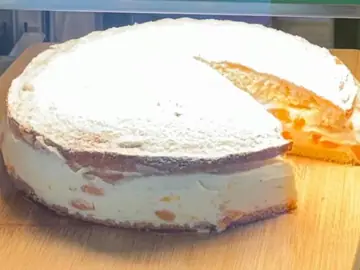 Whole cream cake in the counter display at Salt & Roost.