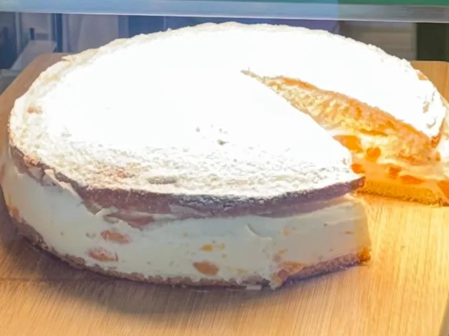 Whole cream cake in the counter display at Salt & Roost.